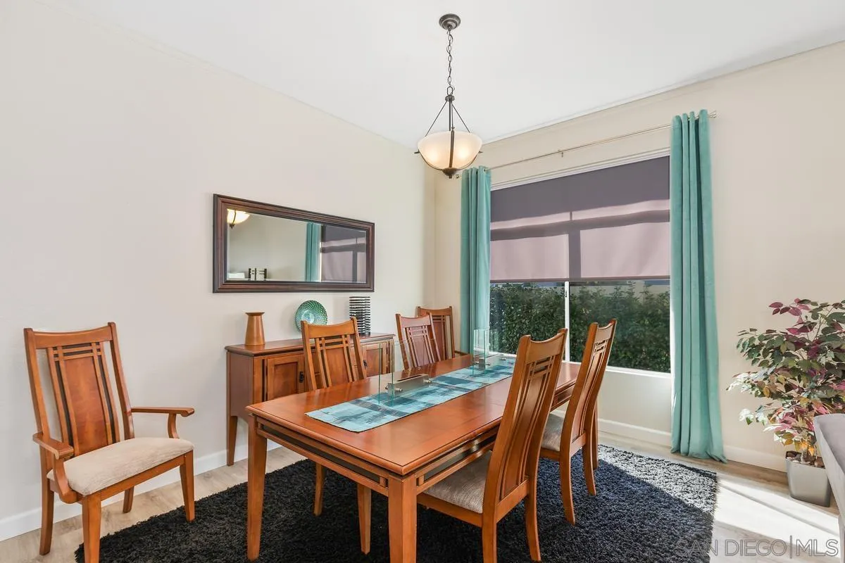 45627 Caminito Olite Temecula, CA 92592 - Photo 8 of 24 a dining room with furniture a chandelier and window