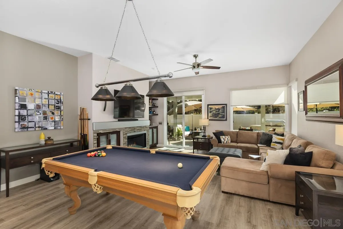 45627 Caminito Olite Temecula, CA 92592 - Photo 10 of 24 a living room with furniture a table and wooden floor