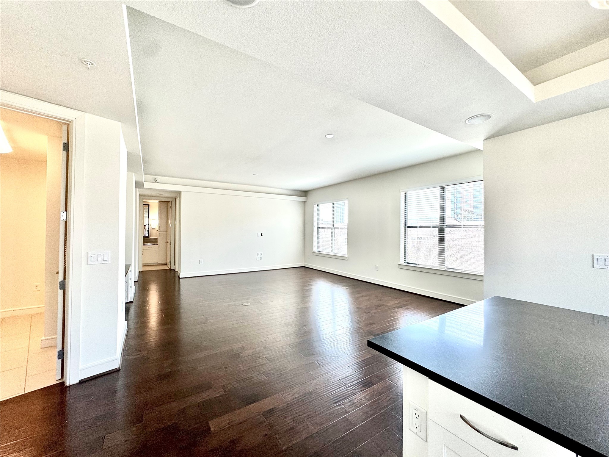 2303 Mid Lane, Unit 228 Houston, TX 77027 - Photo 6 of 30 a view of a livingroom with wooden floor and a window