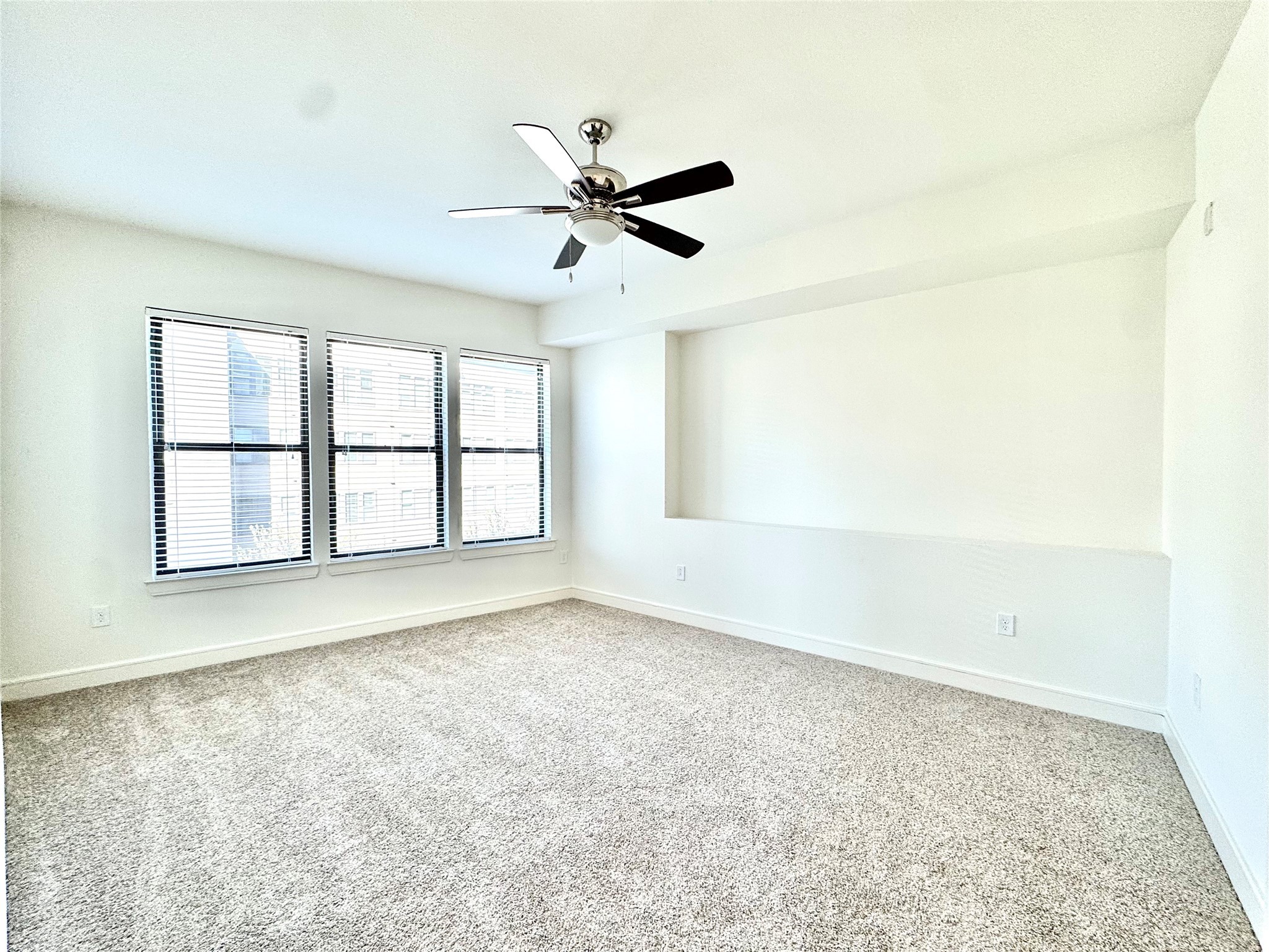 2303 Mid Lane, Unit 228 Houston, TX 77027 - Photo 9 of 30 an empty room with windows and fan