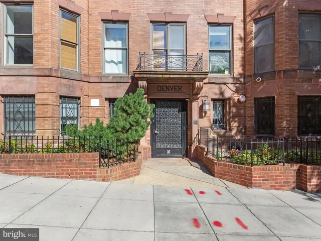 a front view of a building with an outdoor space