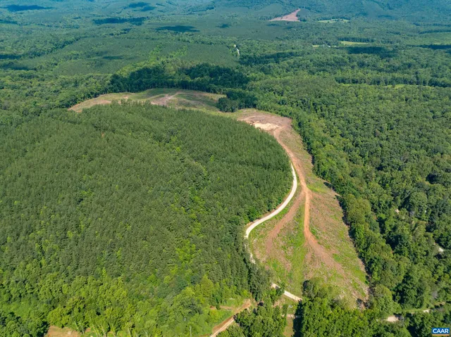a view of lake with green space
