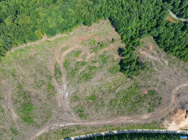 a view of a lake with a yard