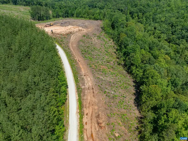 a view of a lush green space with sea