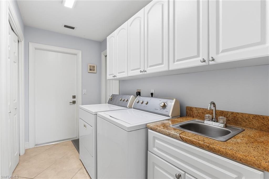1904 Countess Court Naples, FL 34110 - Photo 25 of 33 a utility room with sink dryer and washer
