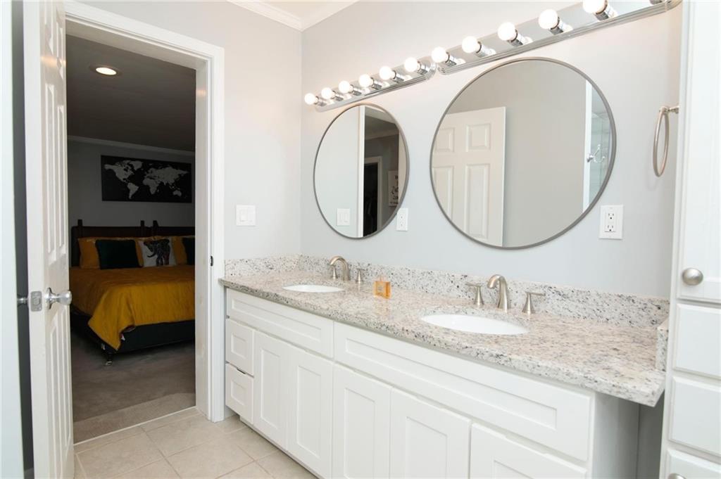 531 Allendale Drive Decatur, GA 30032 - Photo 6 of 19 a en suite bathroom with a double vanity sink and a mirror