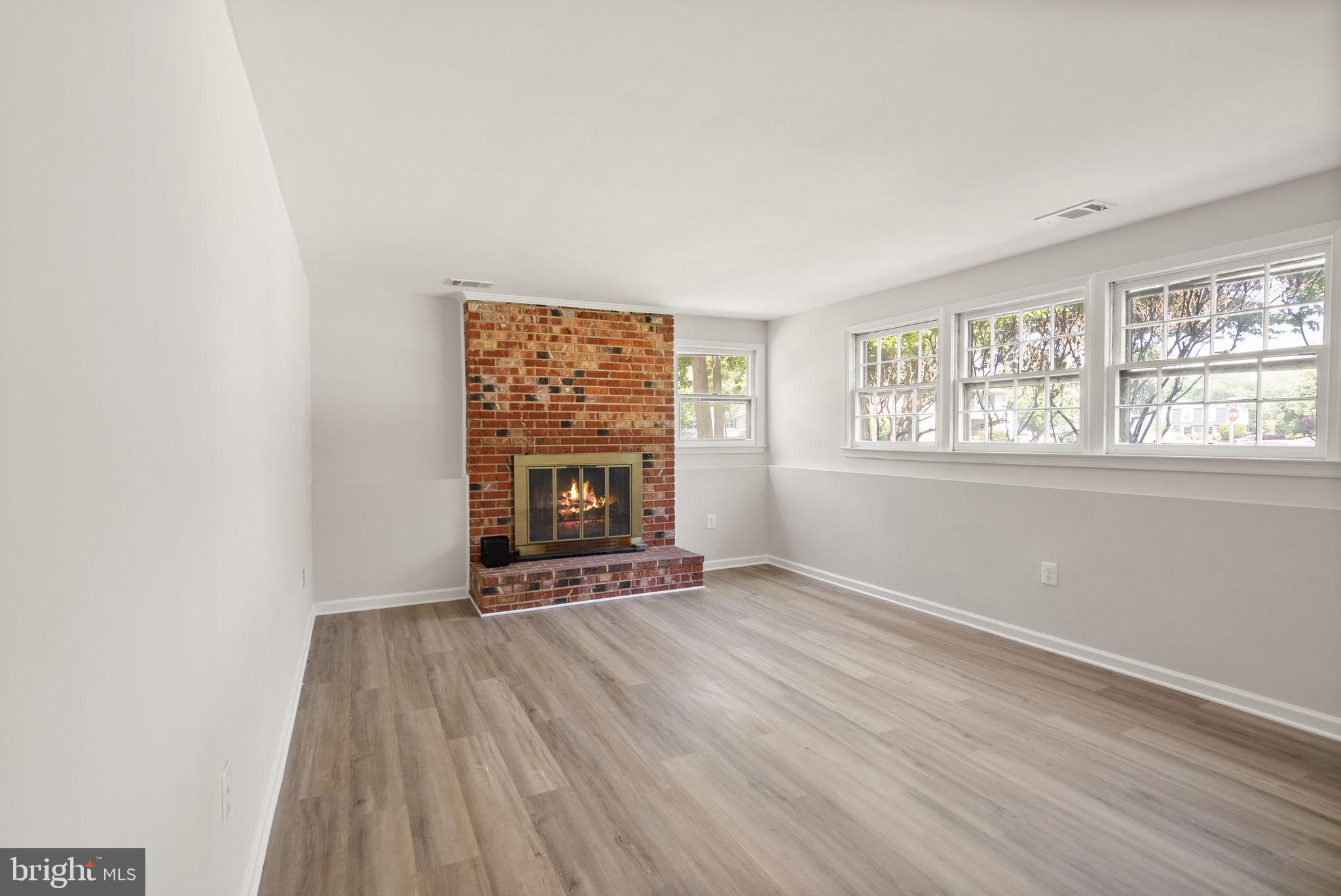 8803 Hayload Court Springfield, VA 22153 - Photo 31 of 49 Basement Rec Room w/ Wood Burning Fireplace