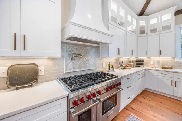 a living room with furniture a table and a large window