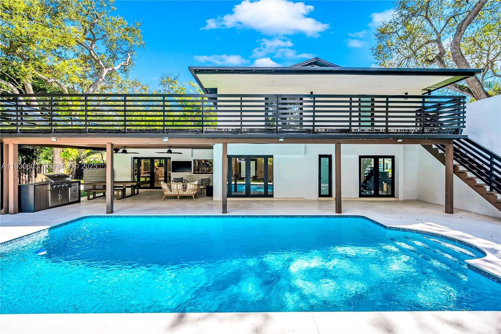 a view of a house with pool and a yard