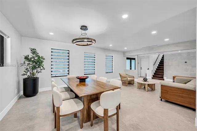 a house with swimming pool in front of it