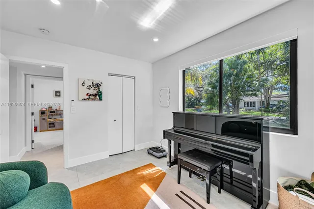 a view of a porch with furniture and garden