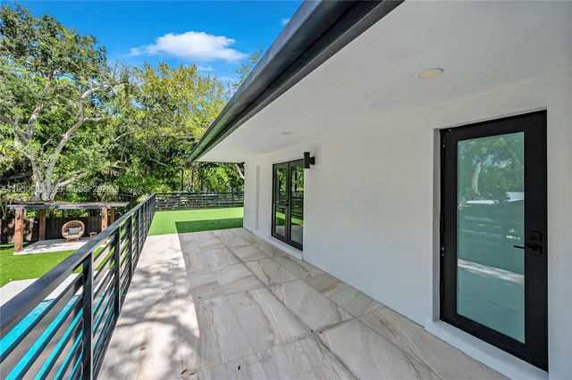 a view of yard with patio