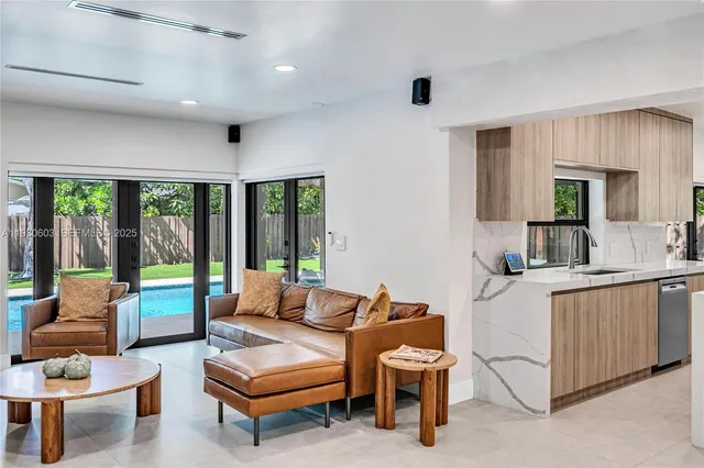 a backyard of a house with swimming pool and large trees