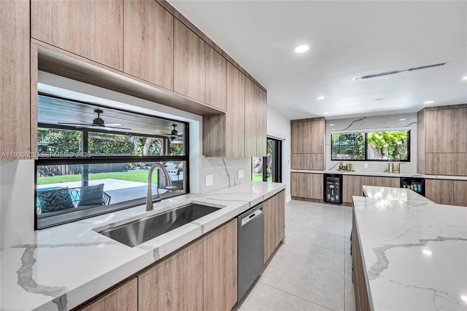 11340 Southwest 74th Court Pinecrest, FL 33156 - Photo 44 of 91 a kitchen with stainless steel appliances kitchen island a large window
