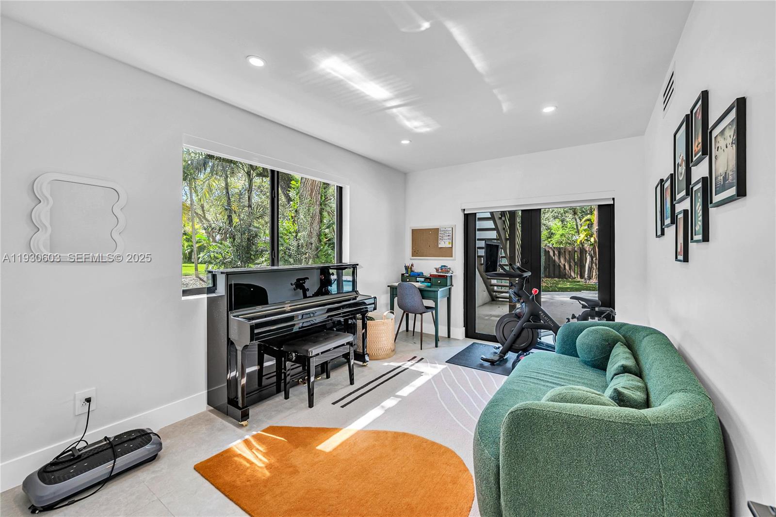 11340 Southwest 74th Court Pinecrest, FL 33156 - Photo 52 of 91 a living room with furniture and a window