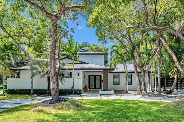 a view of a house with a yard porch and sitting area