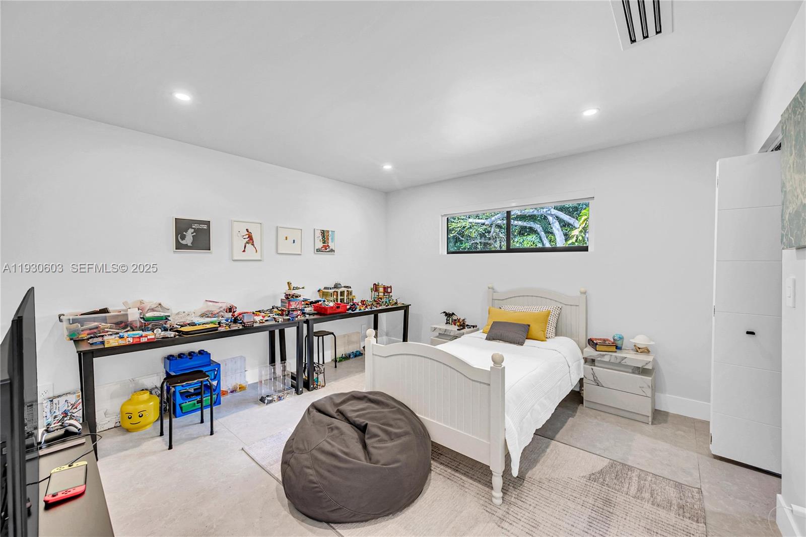 11340 Southwest 74th Court Pinecrest, FL 33156 - Photo 63 of 91 a living room with furniture and a flat screen tv