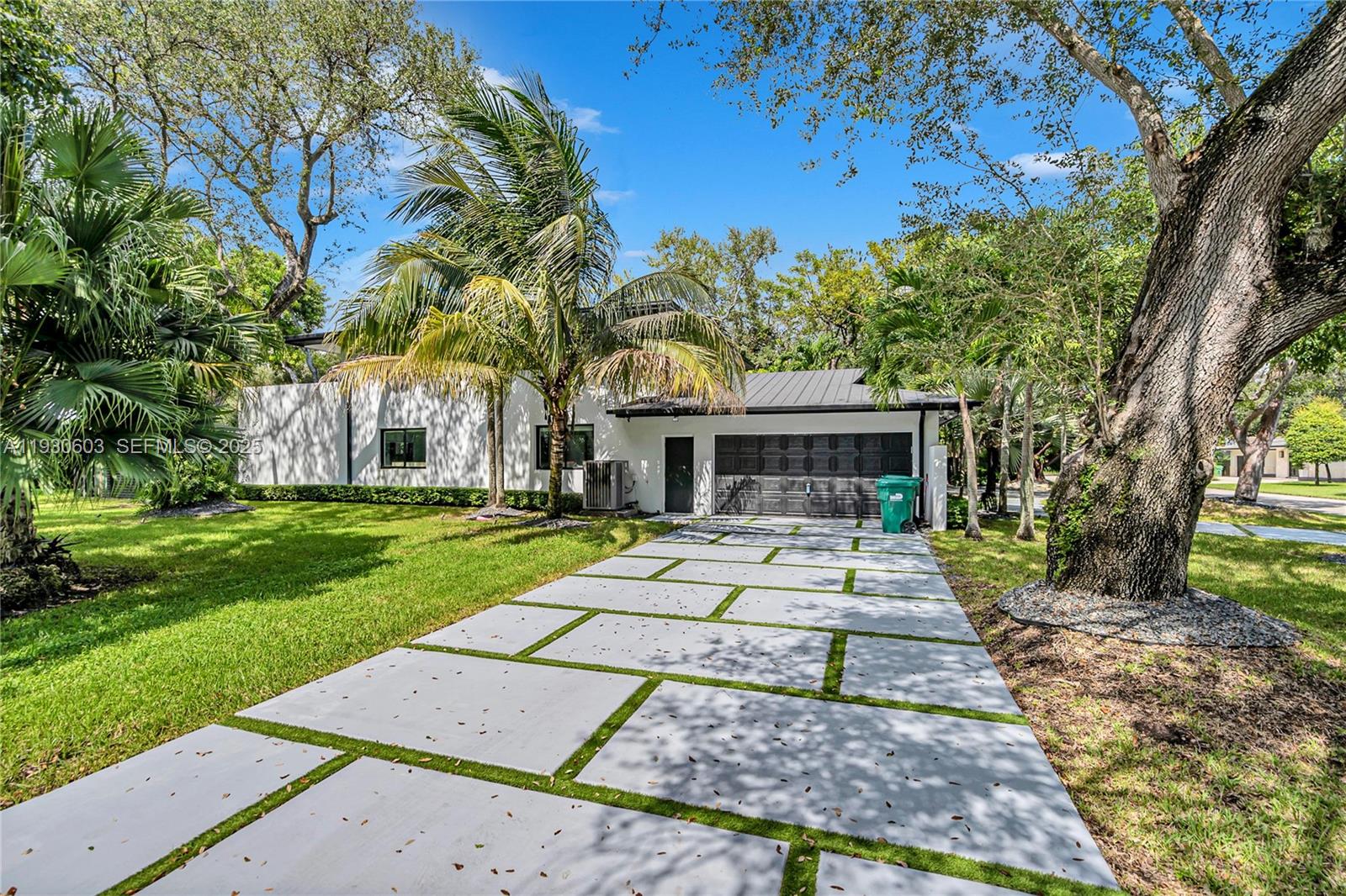 11340 Southwest 74th Court Pinecrest, FL 33156 - Photo 71 of 91 front view of a house with a yard