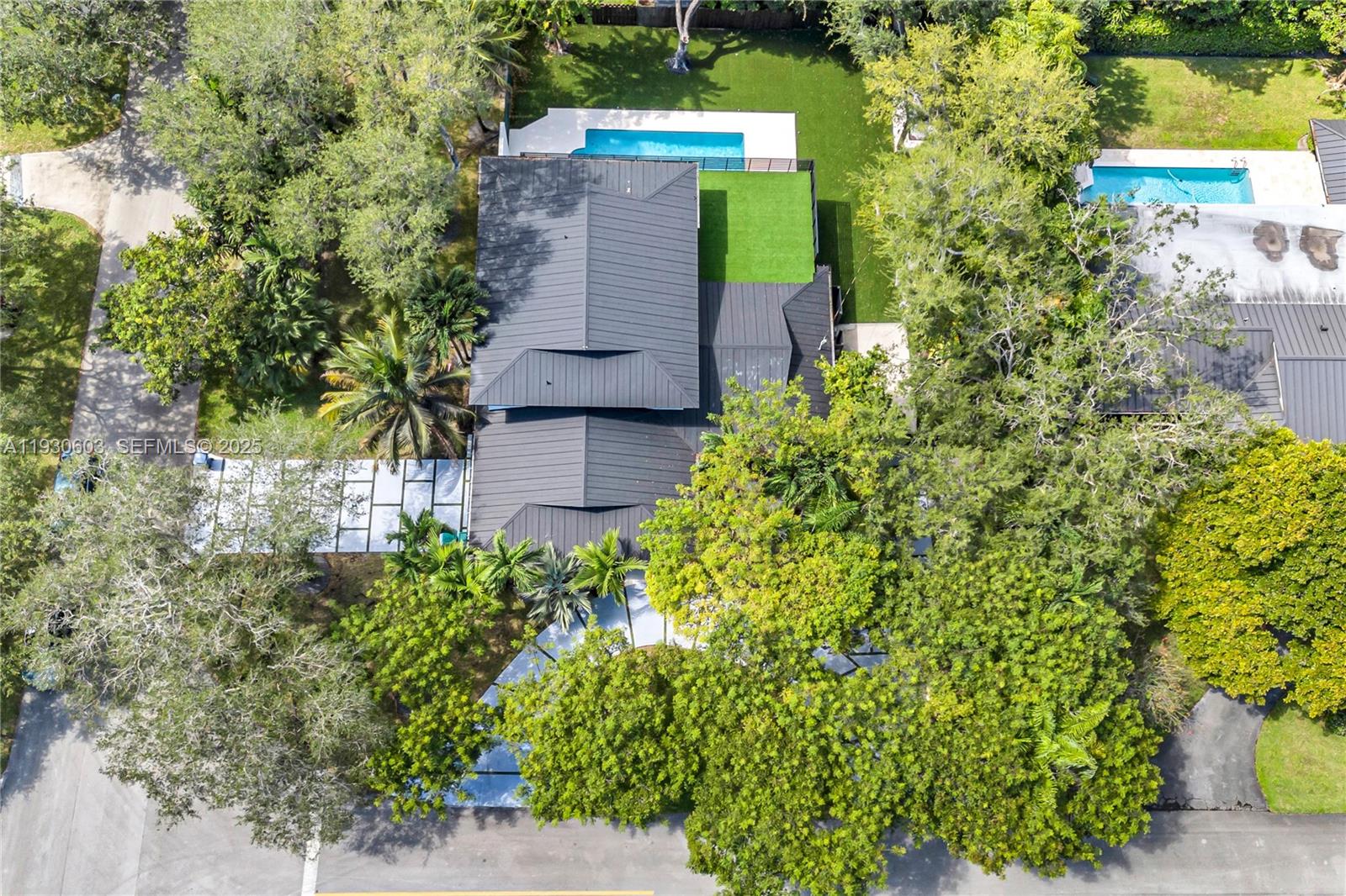 11340 Southwest 74th Court Pinecrest, FL 33156 - Photo 90 of 91 an aerial view of a house with a yard and garden