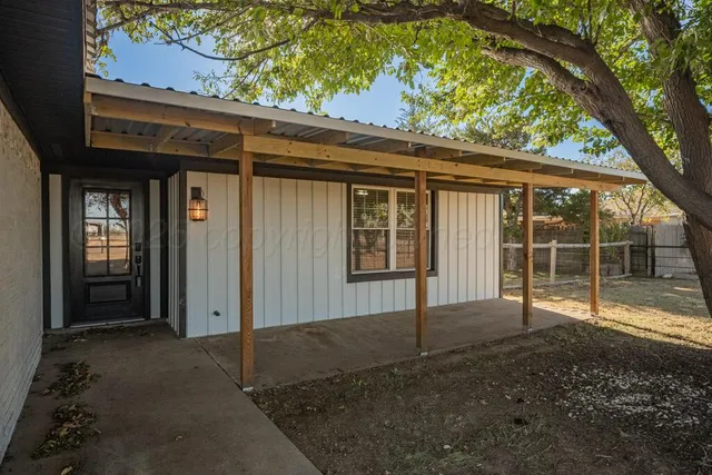 a view of backyard with green space
