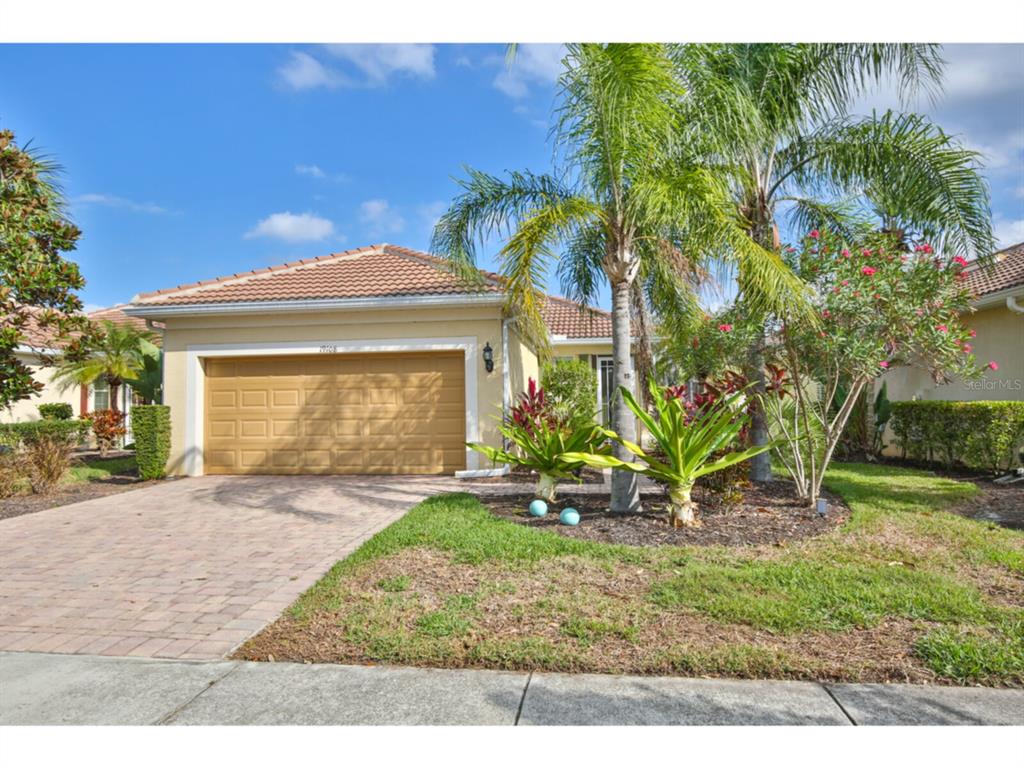 19108 Lappacio Street Venice, FL 34293 - Photo 1 of 33 a front view of a house with a yard