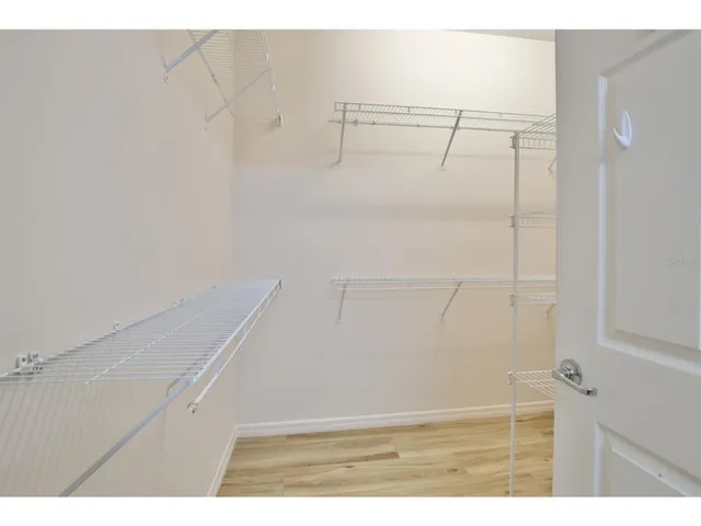 a view of an empty walk in closet