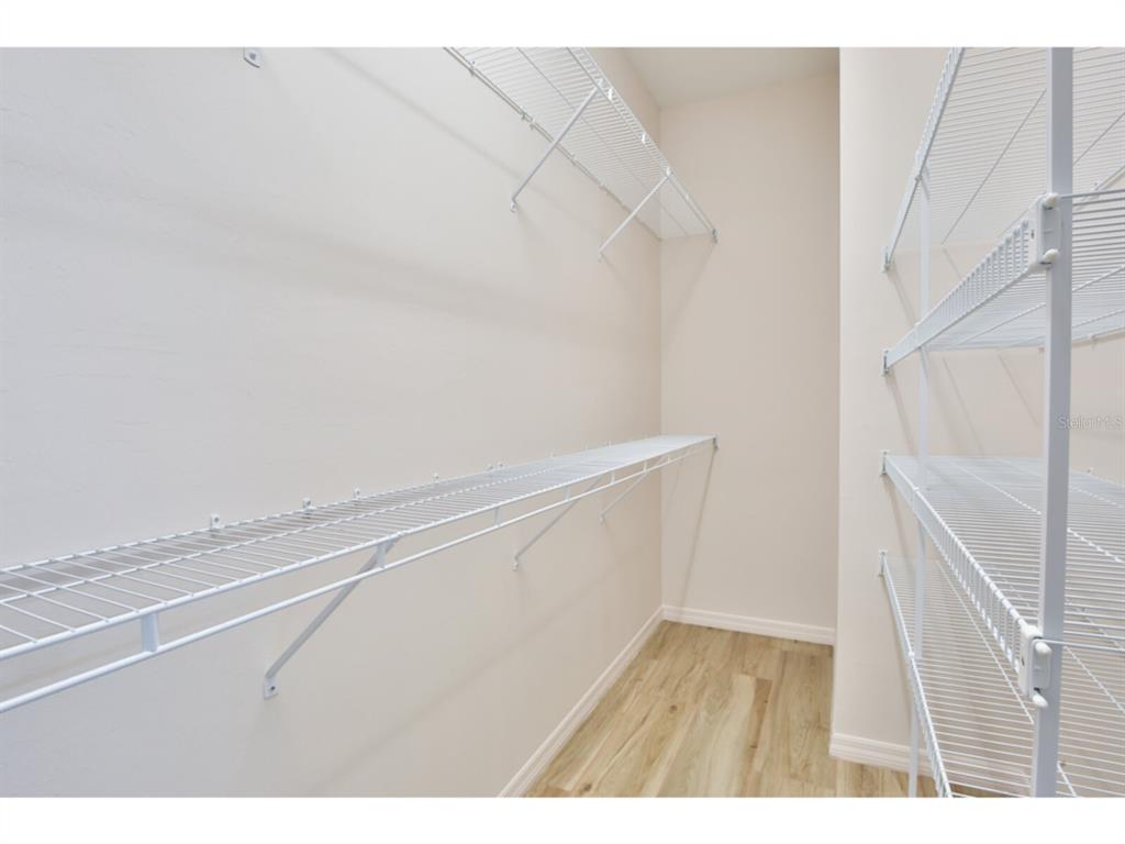 19108 Lappacio Street Venice, FL 34293 - Photo 17 of 33 a view of an empty walk in closet