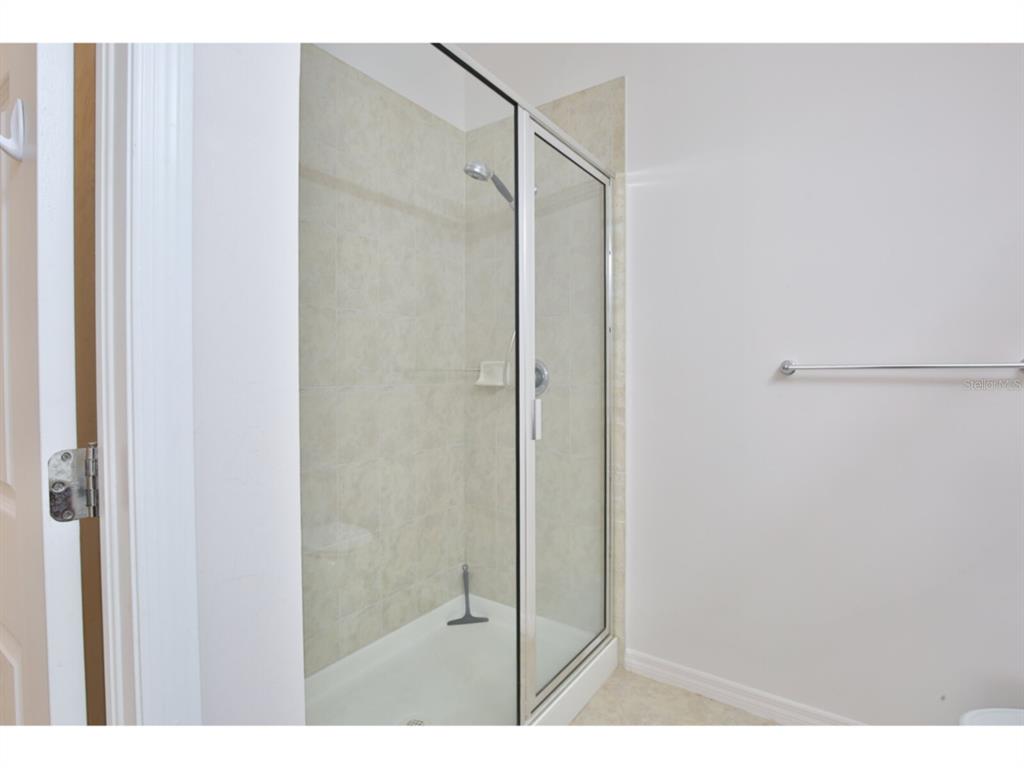19108 Lappacio Street Venice, FL 34293 - Photo 18 of 33 a bathroom with a shower