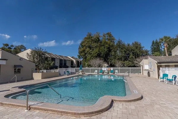 a view of a swimming pool with a patio
