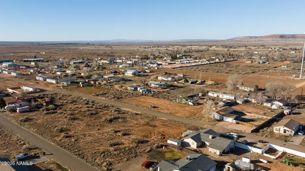 an aerial view of residential building and parking space
