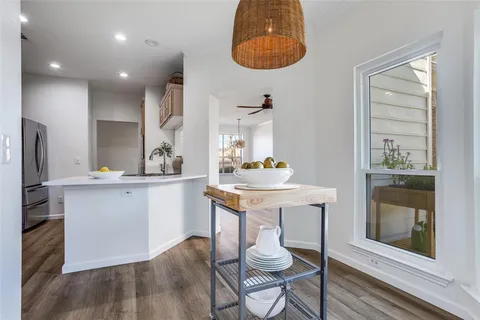 a kitchen with stainless steel appliances kitchen island granite countertop a sink and cabinets