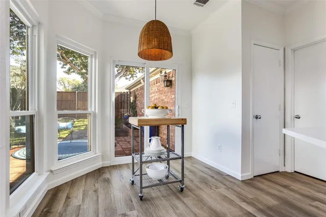 a view of a room that has a bed and a window in it