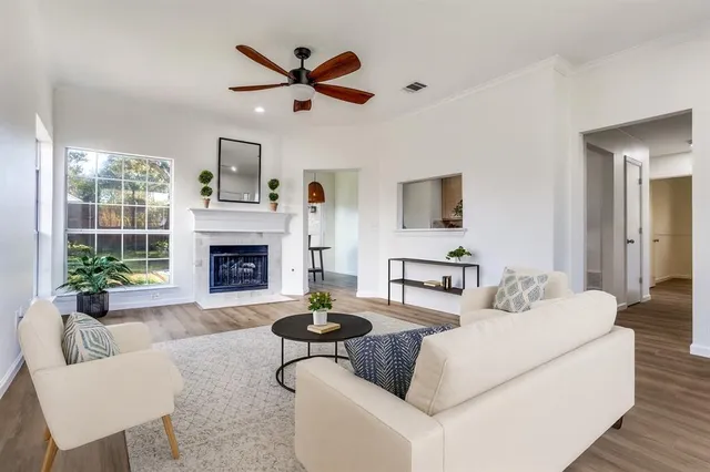 a living room with furniture and a fireplace