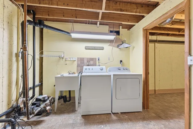 a room with cabinets and washer
