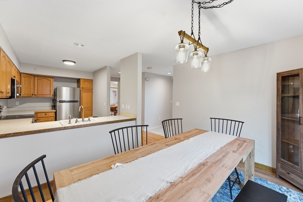 36 Shady Brook, Unit 36 West Springfield, MA 01089 - Photo 5 of 20 a view of a hallway with furniture and wooden floor