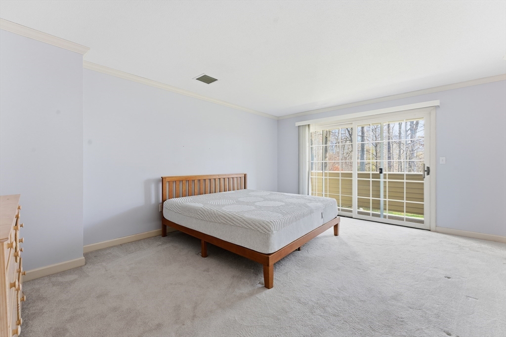 36 Shady Brook, Unit 36 West Springfield, MA 01089 - Photo 9 of 20 a bed sitting in a room next to a window