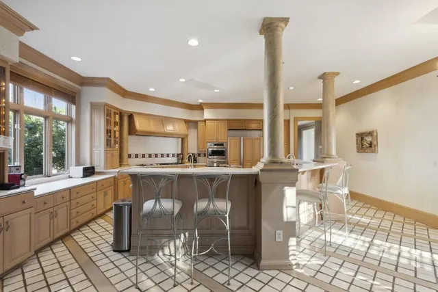 a view of a living room and kitchen