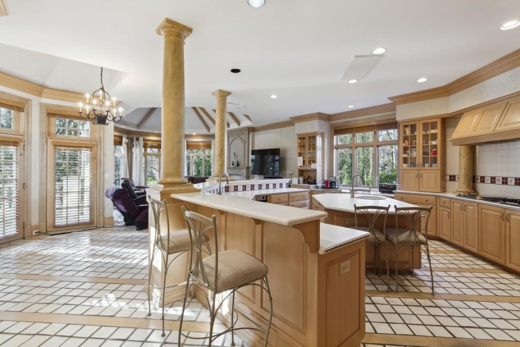 712 West Paces Ferry Road Northwest Atlanta, GA 30327 - Photo 16 of 26 a large kitchen with a table and chairs in it