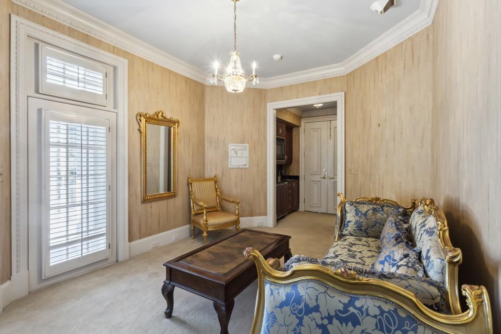 712 West Paces Ferry Road Northwest Atlanta, GA 30327 - Photo 23 of 26 a living room with furniture and a chandelier