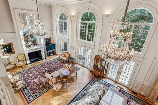 a living room with furniture fireplace and flat screen tv