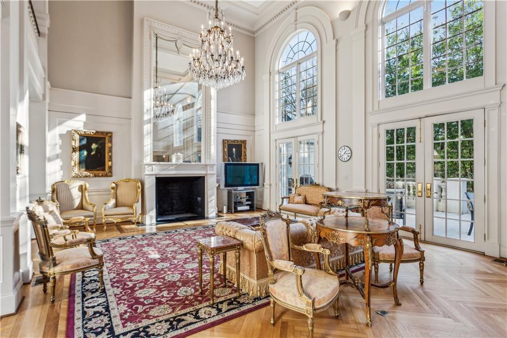 712 West Paces Ferry Road Northwest Atlanta, GA 30327 - Photo 5 of 26 a living room with fireplace furniture and a large window