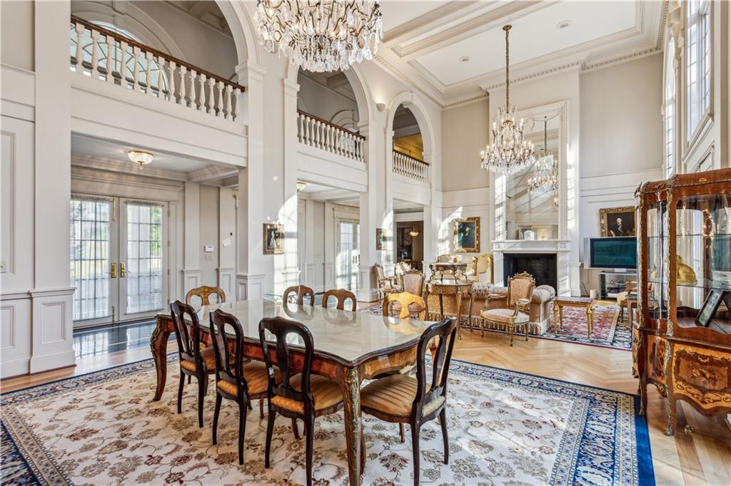712 West Paces Ferry Road Northwest Atlanta, GA 30327 - Photo 8 of 26 a view of a dining room with furniture window and wooden floor