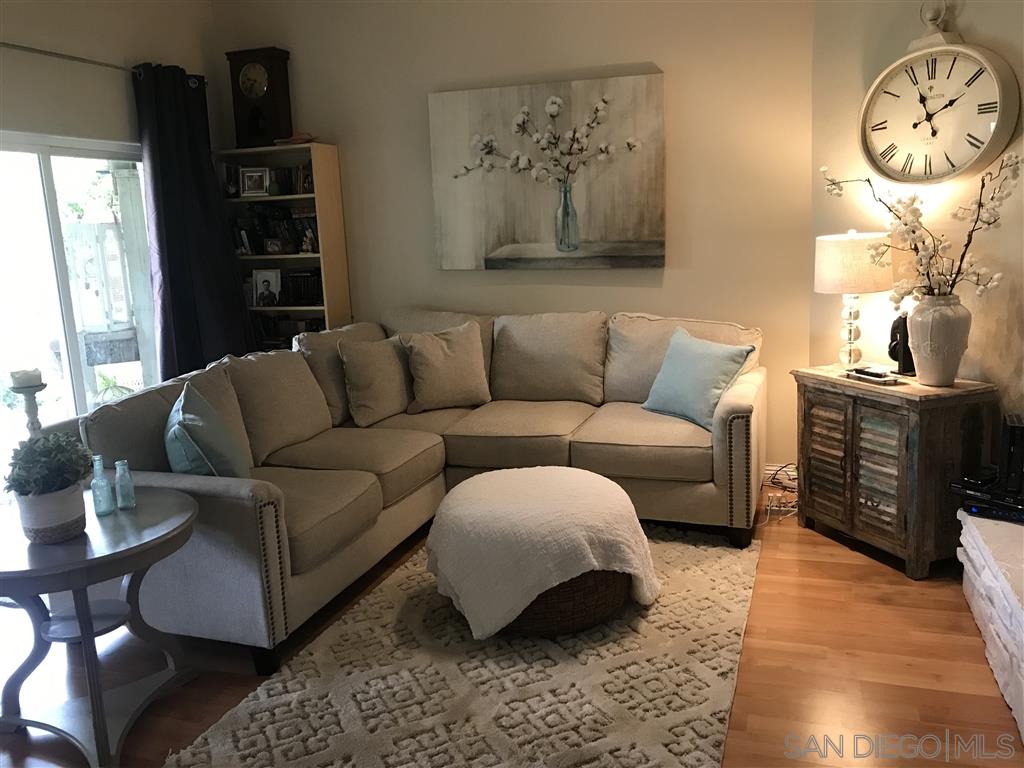 15950 Mactan Road Valley Center, CA 92082 - Photo 11 of 25 a living room with furniture a bed and a window