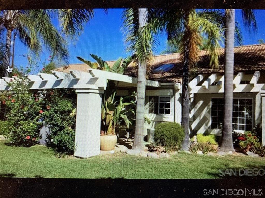 15950 Mactan Road Valley Center, CA 92082 - Photo 3 of 25 a view of a house with a yard and plants