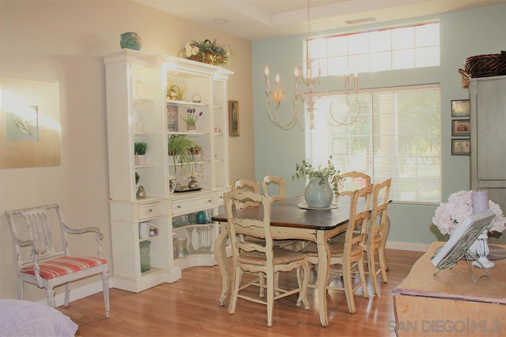 15950 Mactan Road Valley Center, CA 92082 - Photo 7 of 25 a view of a dining room with furniture and wooden floor