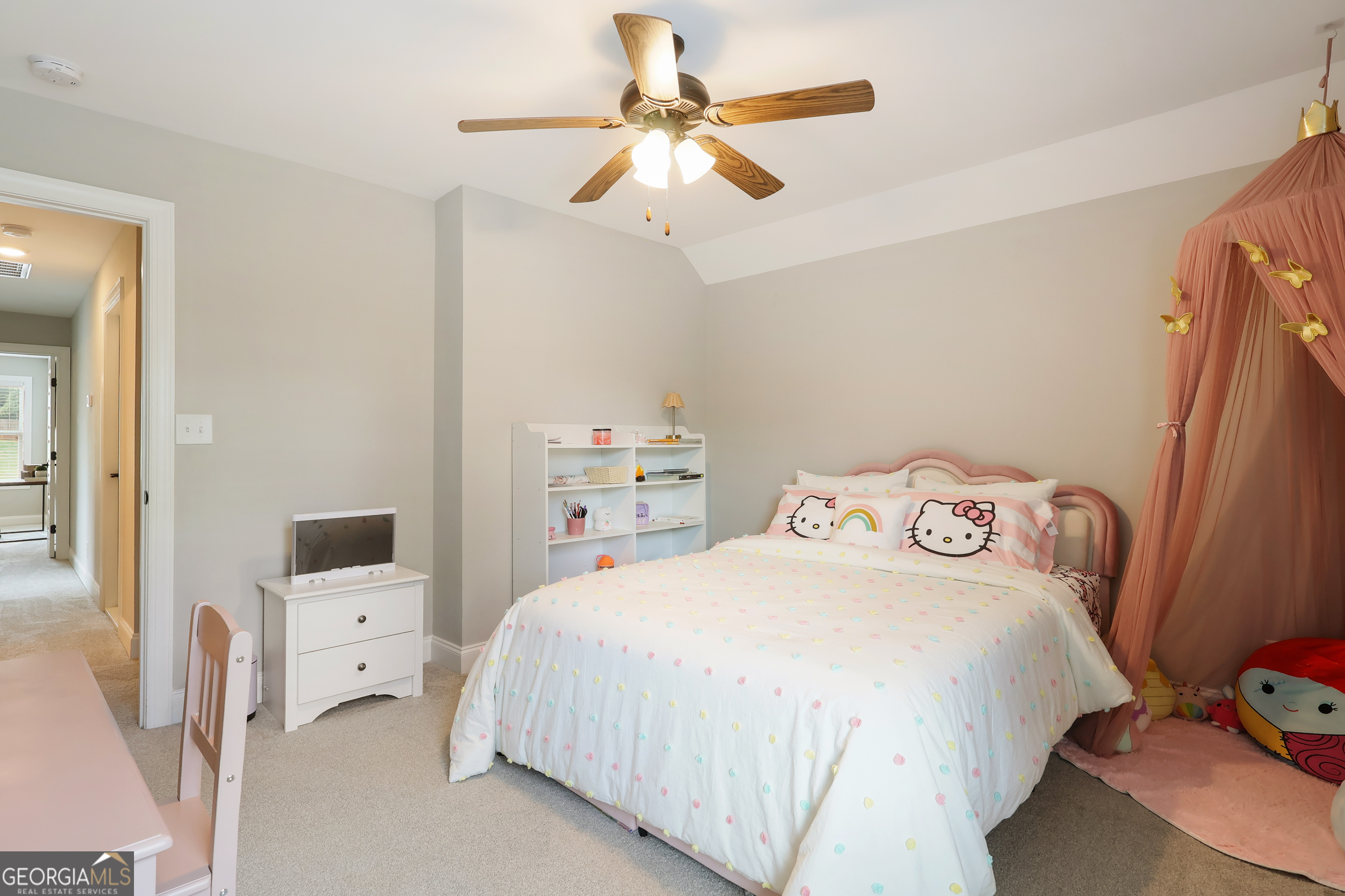 89 Claire Road Forsyth, GA 31029 - Photo 27 of 40 a bedroom with a bed and a chandelier