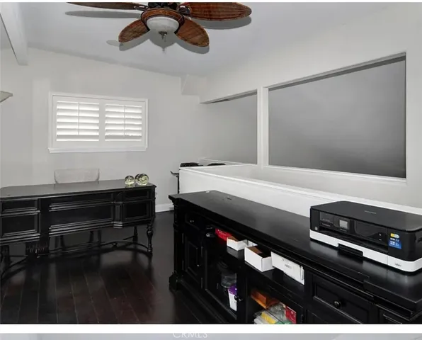 a room with furniture pool table and window