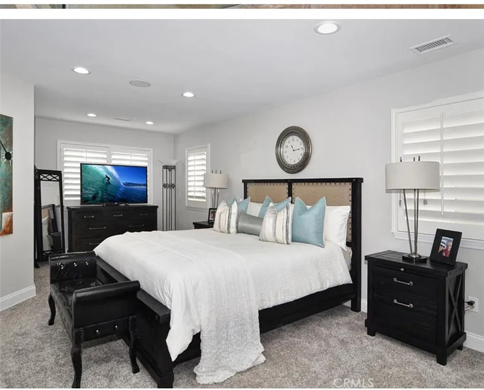 211 8th Street Huntington Beach, CA 92648 - Photo 7 of 16 a bed room with a bed and a television