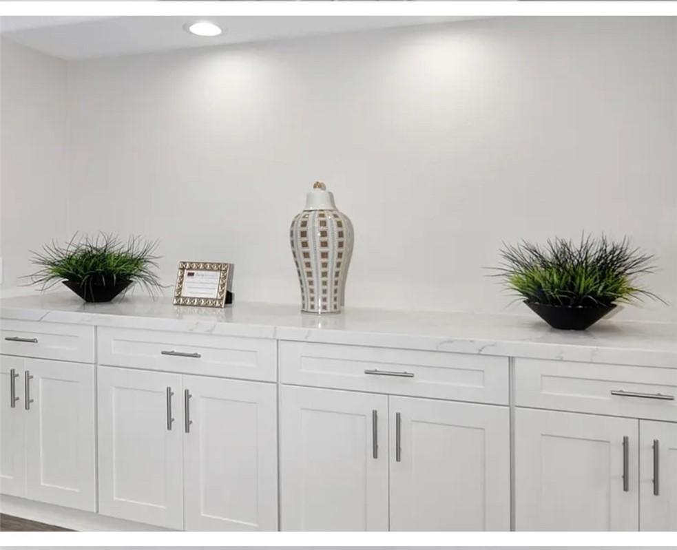 211 8th Street Huntington Beach, CA 92648 - Photo 10 of 16 a view of kitchen with cabinets and wooden floor