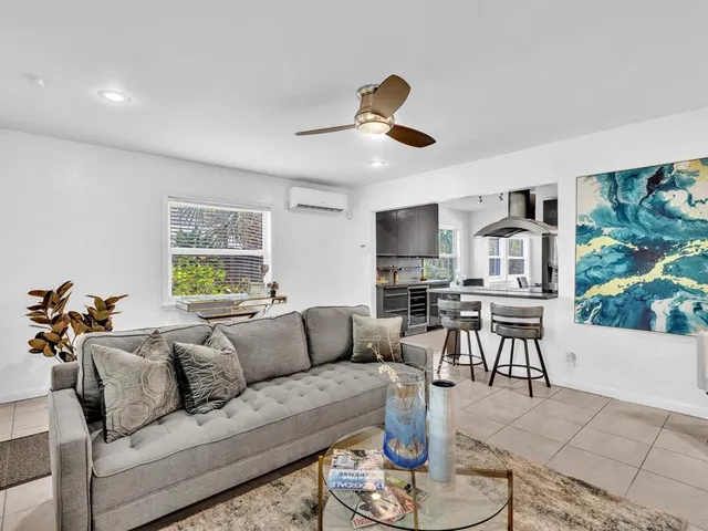 a kitchen with stainless steel appliances granite countertop a stove and a refrigerator